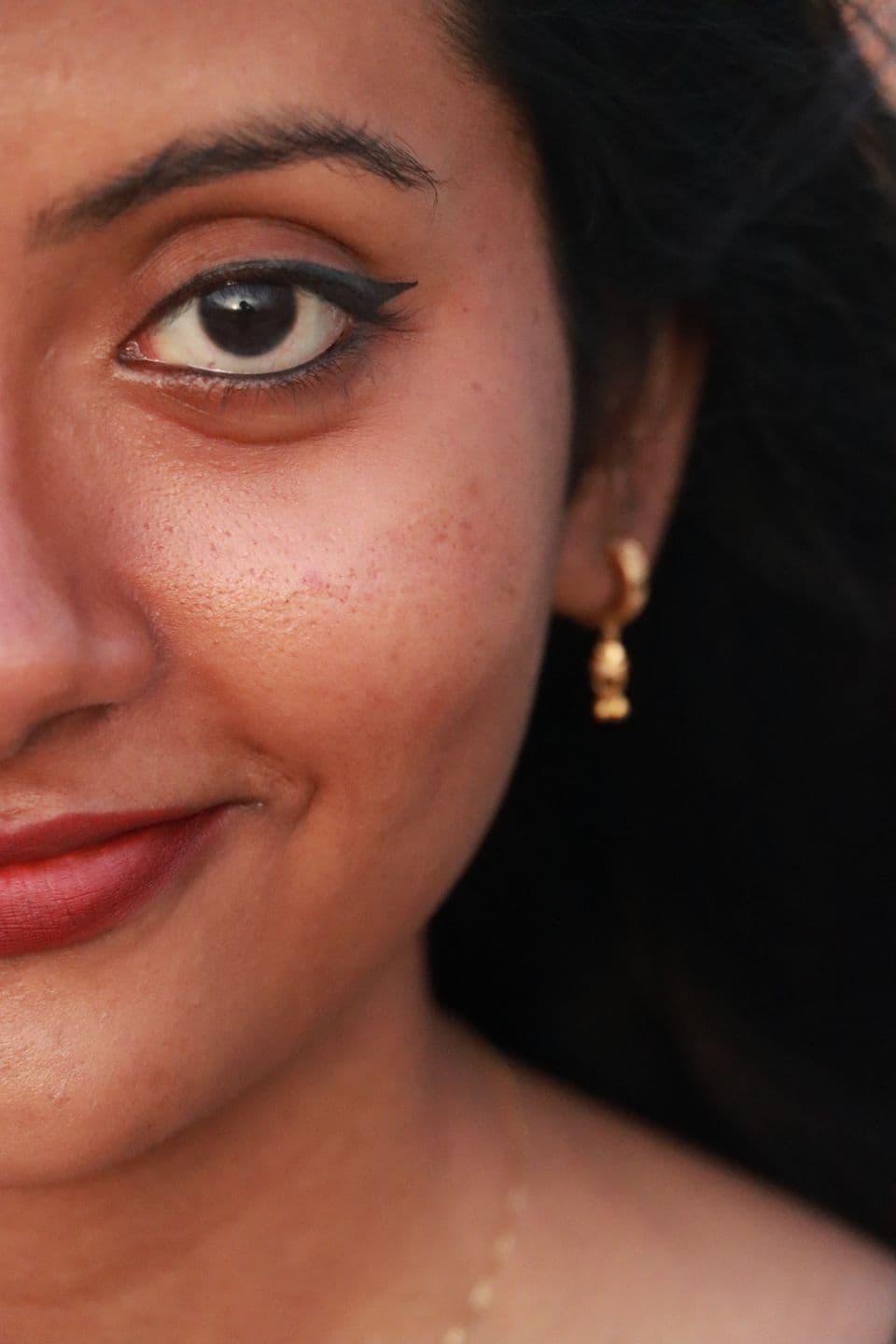 Close-up makeup reference on a South Asian model, shown in original skin tone
