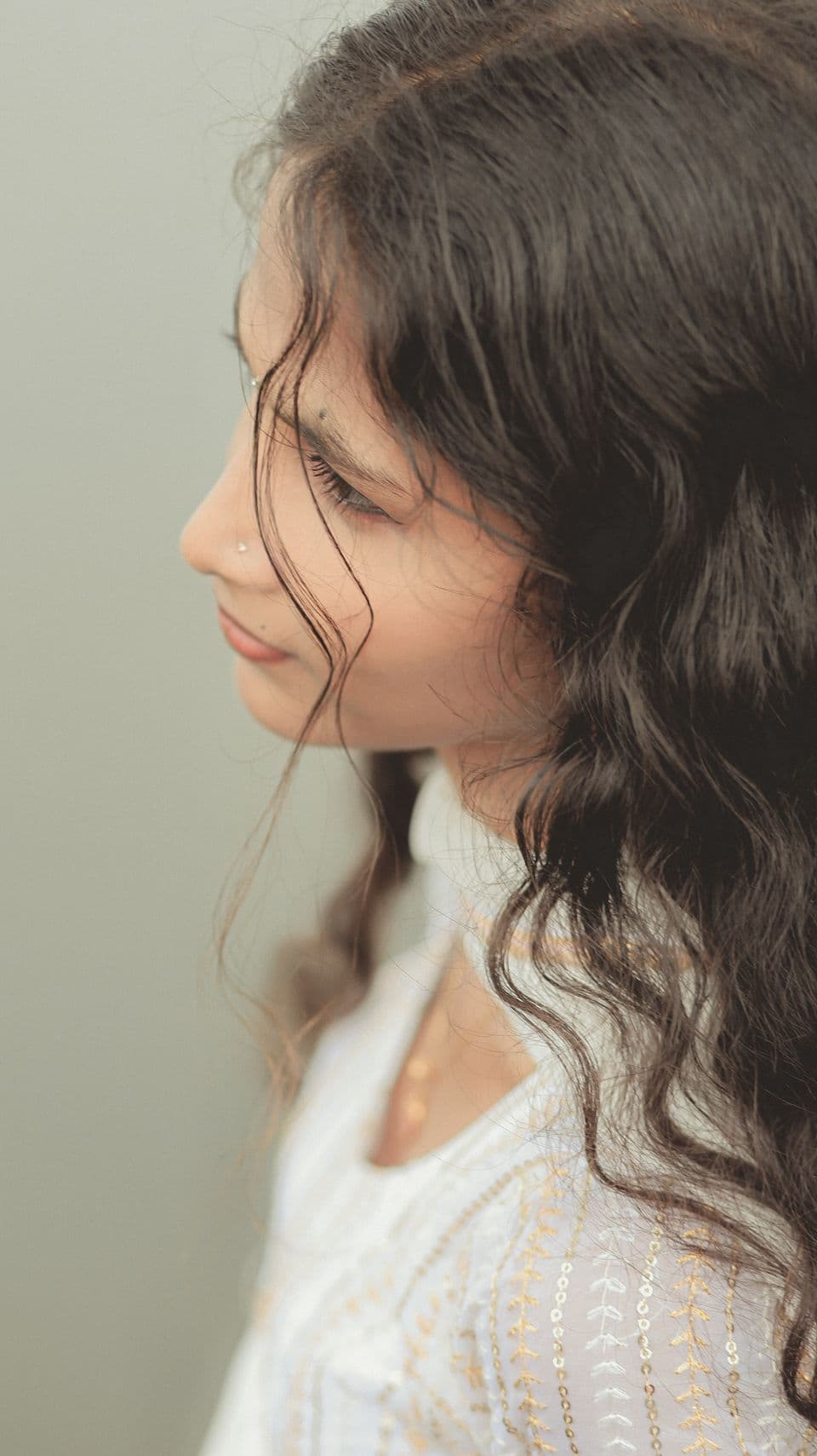 South Asian model with naturally wavy hair